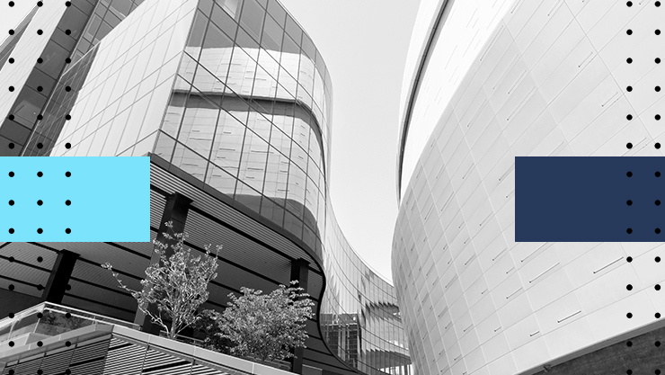 A stylized image of two modern buildings