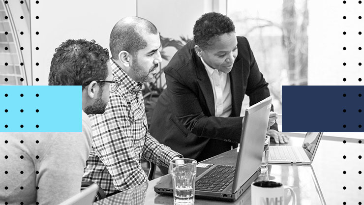 Three people collaborating on their laptops
