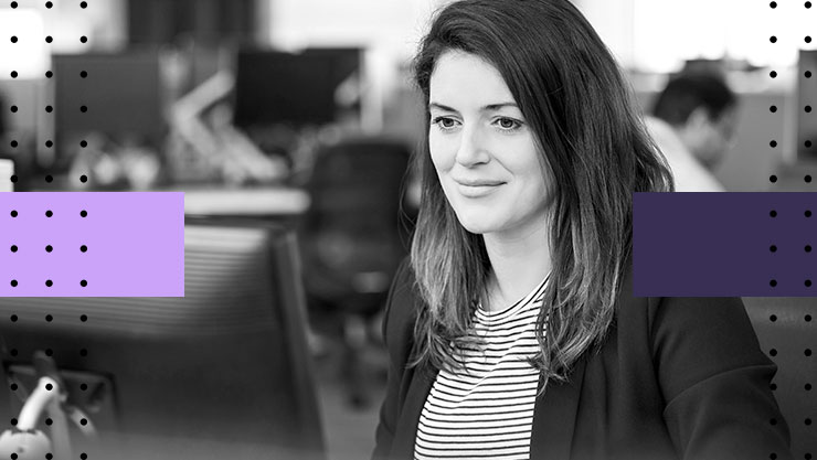 Stylized image of a woman working in a large office