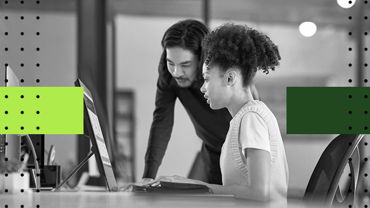 Two people looking at a computer screen