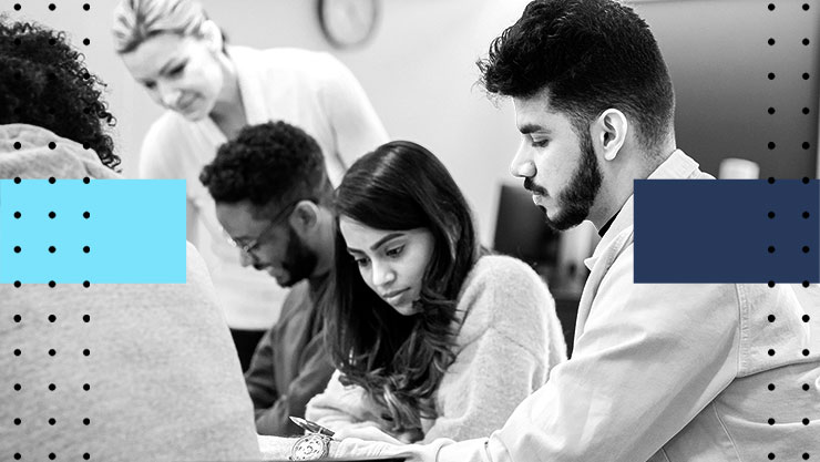 A group of people working together in a classroom