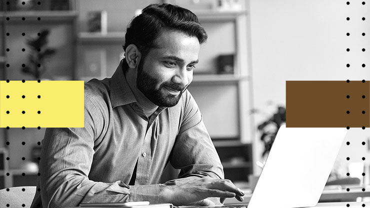 A man looking at his laptop