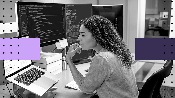 A woman working at her desk on her laptop