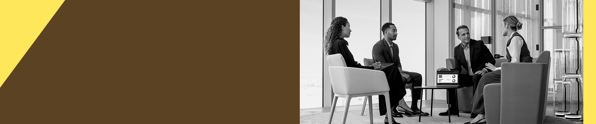 A group of people having a discussion around a table
