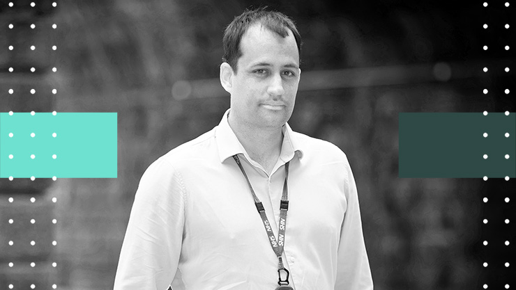 A man with a lanyard around his neck